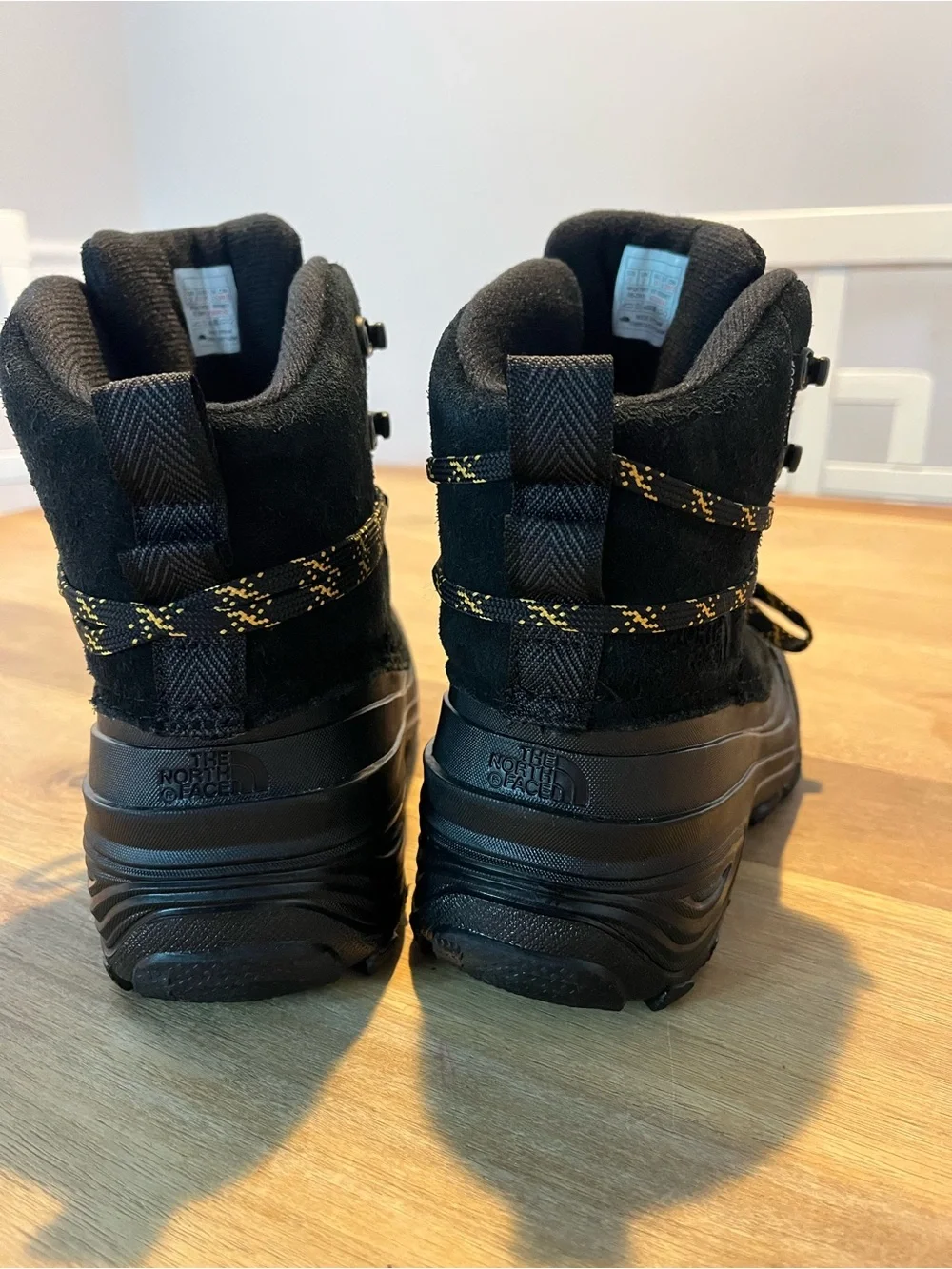 The North Face Black Boots with Yellow-Accent Laces